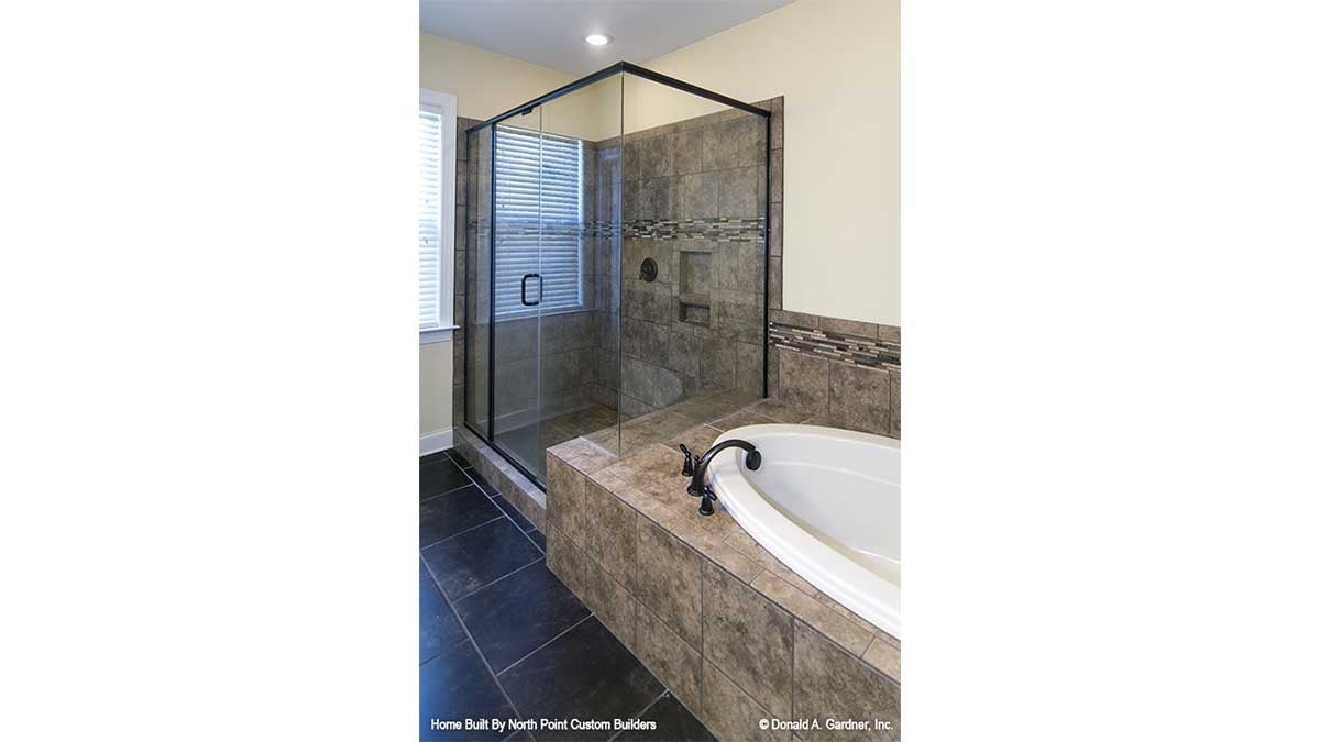 Walk-in shower next to a soaking tub in the bathroom. The Lisenby plan #1220.