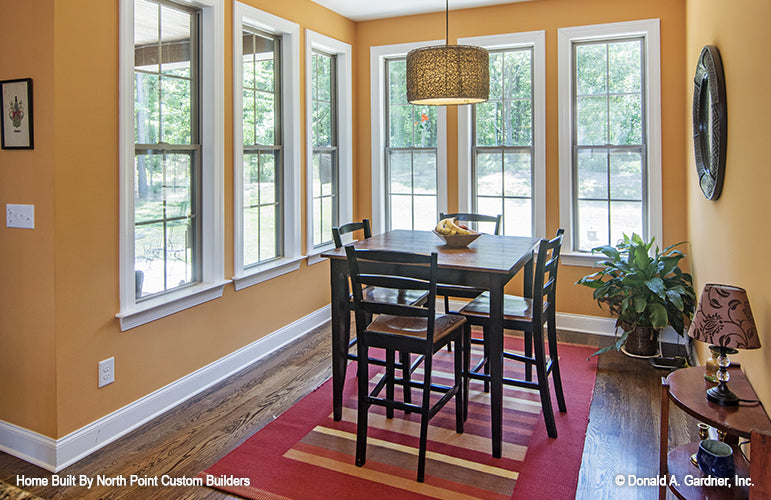 Wood floors in the dining room. The Lisenby plan #1220.