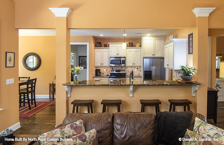 Bar seating in the kitchen. The Lisenby plan #1220.