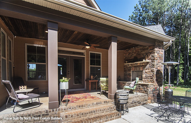 Rear covered porch with ceiling fan. The Lisenby plan #1220.