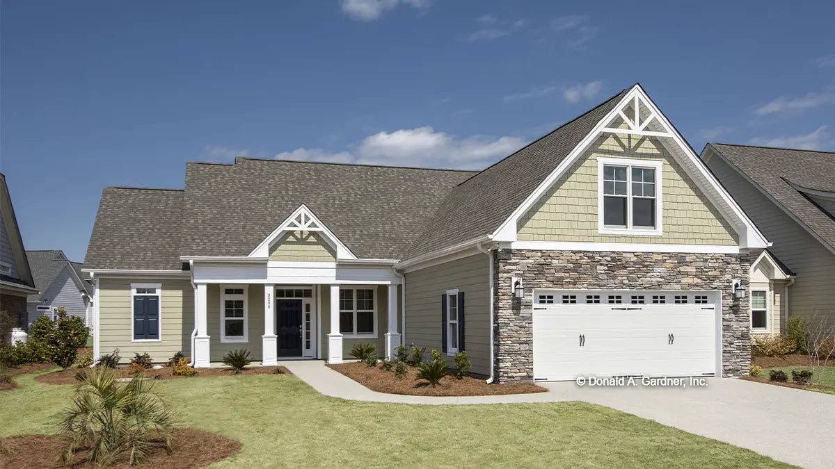 This is a photograph of the front of one story house plan 773 The Lochmere as built by a customer