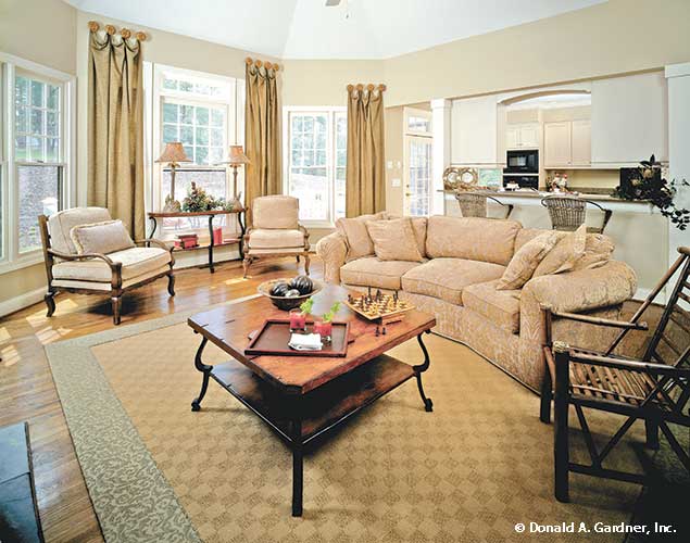 Wood floors and large windows in the great room. The Longleaf plan 802.