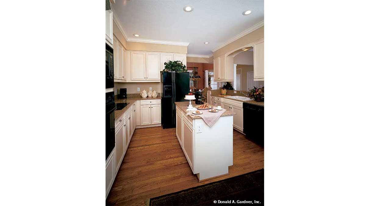 Recessed lighting and island in the kitchen. The Longleaf plan 802.