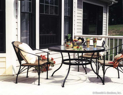 Patio table and chairs on the rear deck. The Longleaf plan 802.