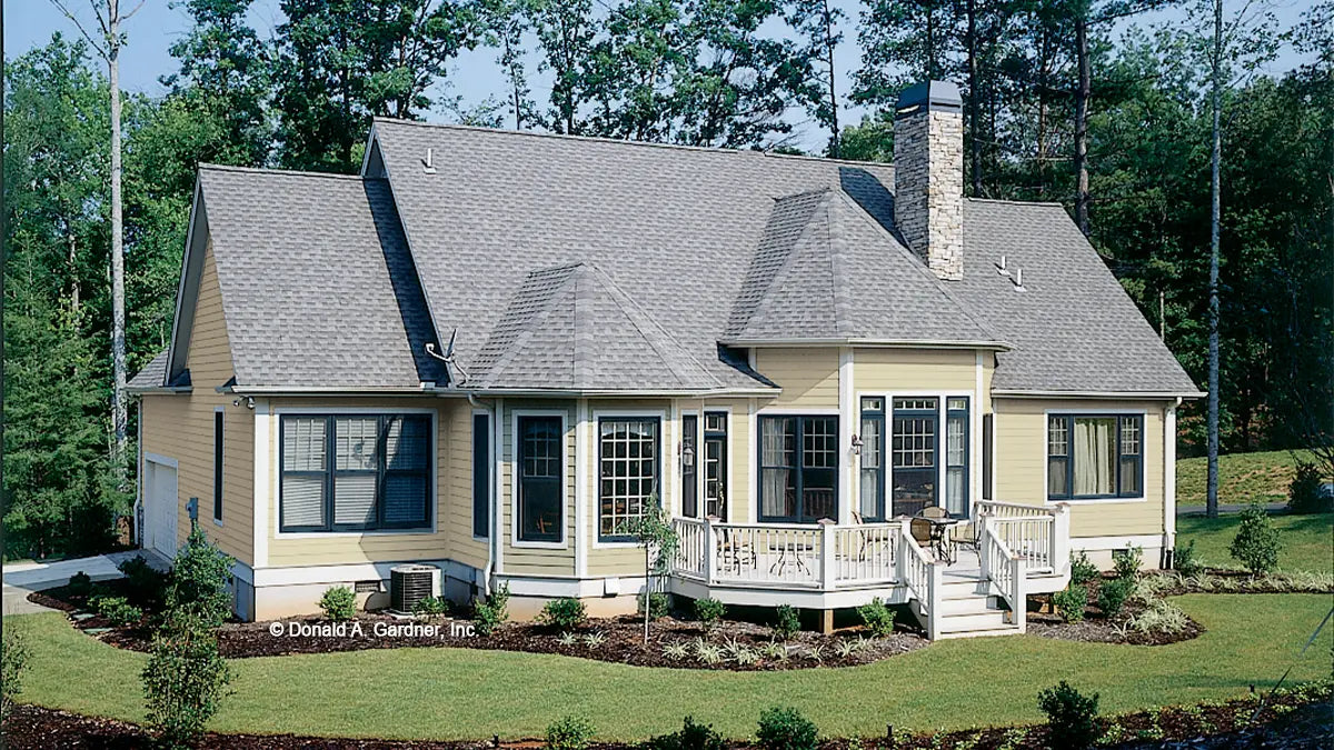 This is a rear view photograph of a ranch home. The Longleaf plan 802.