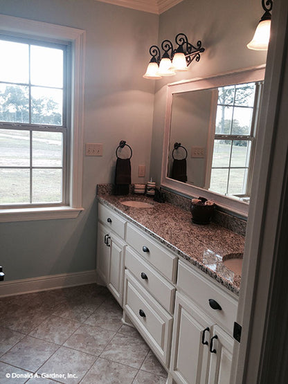 Bathroom with double sinks pictured for house plan 1319 The Lucerne