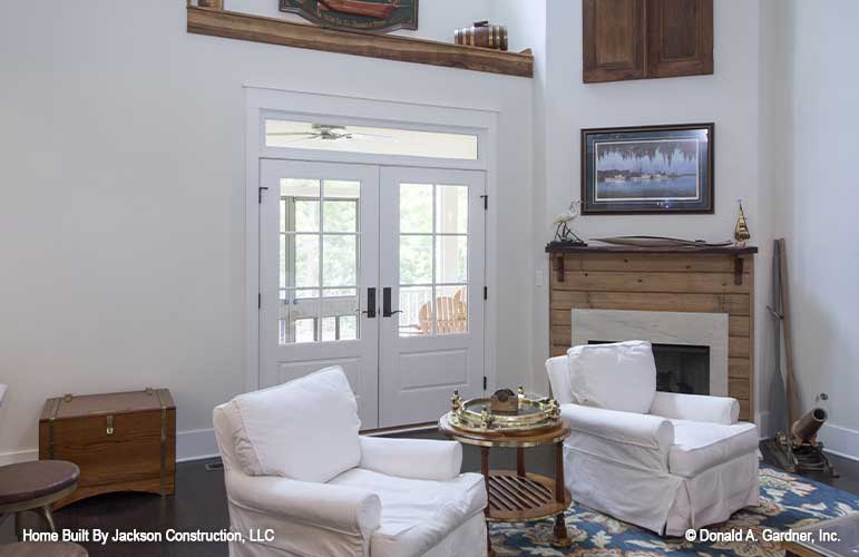 well-lite great room with fireplace corner caddy beside the French patio doors.  Lucinda plan 1514 