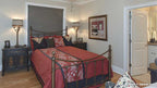Secondary bedroom with bathroom door off to the side. The Lucy plan 1415