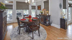 Inviting dining room with natural light from the large window and two patio doors. The Lucy plan 1415