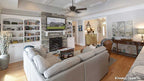 Full visual of the great room with fireplace and built in shelves. The Lucy plan 1415