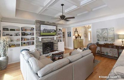 Full visual of the great room with fireplace and built in shelves. The Lucy plan 1415