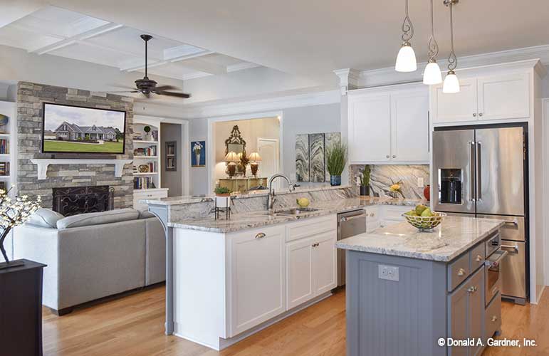 Side view of the beautiful kitchen, displaying the island and the bar. The Lucy plan 1415