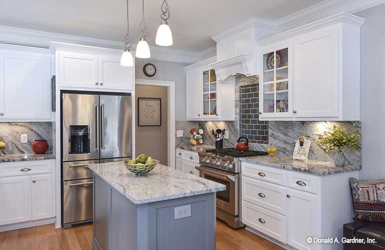 Island view, beautiful stainless-steel appliances and marble counter tops. The Lucy plan 1415