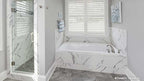 Relaxing tub with window over giving plenty of natural light and the separate walk-in shower.  The Lucy plan 1415
