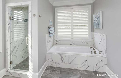 Relaxing tub with window over giving plenty of natural light and the separate walk-in shower.  The Lucy plan 1415