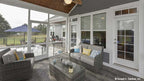 Second angle of the screened in porch with vaulted ceiling showing the two doors to access the home. The Lucy plan 1415