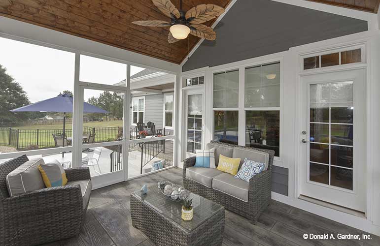 Second angle of the screened in porch with vaulted ceiling showing the two doors to access the home. The Lucy plan 1415