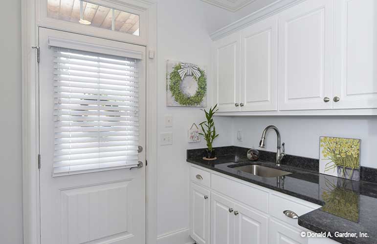 Entry door leading to the sink in the utility room. The Lucy plan 1415