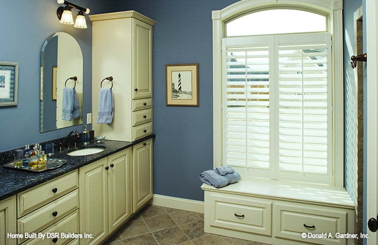 Window bench seating in the master bathroom. The Lujack plan 1043.