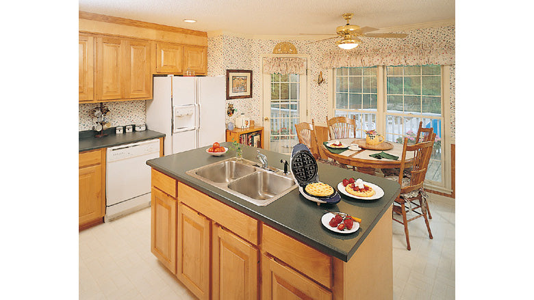 Island with a sink in the kitchen. The MacLeish plan 304.