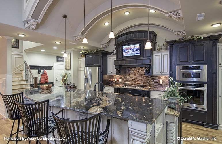 Stainless-steel appliances in the kitchen. The MacAllaster plan 838. 