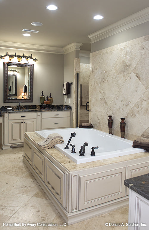 Tiled wall behind the bath tub in the master bathroom. The MacAllaster plan 838. 