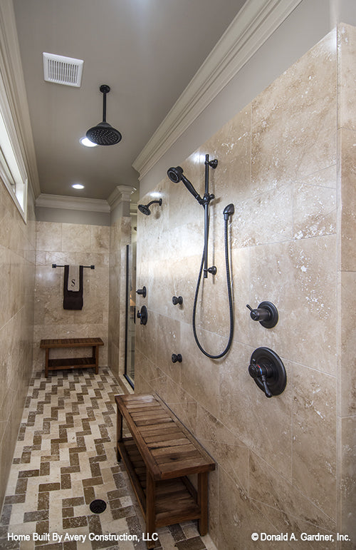 Multiple shower heads in the walk-in shower in the master bathroom. The MacAllaster plan 838. 