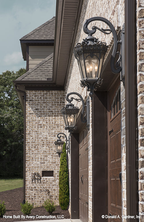 Lantern lights on the side exterior of the garage. The MacAllaster plan 838. 