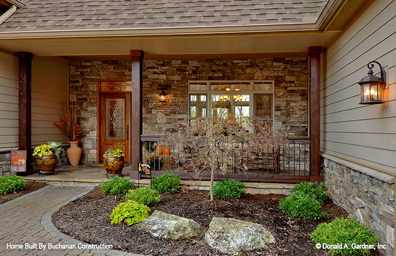 This is a photograph of the front porch of rustic house plan 1173 The Marcourt as built by a customer