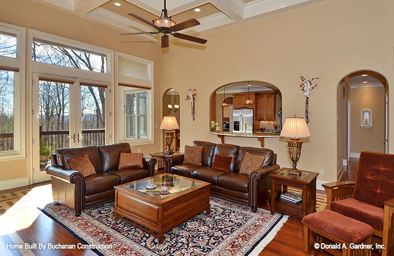 This is a photograph of the great room and kitchen of rustic house plan 1173 The Marcourt as built by a customer