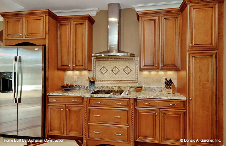 This is a photograph of the kitchen cabinets of rustic house plan 1173 The Marcourt as built by a customer