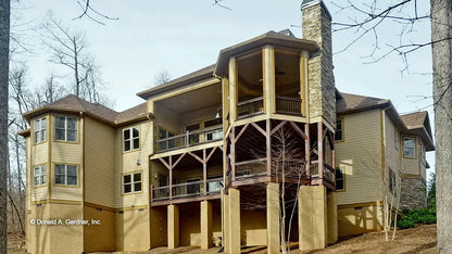 This is a photograph of the rear of cottage house plan 1173 The Marcourt as built by a customer