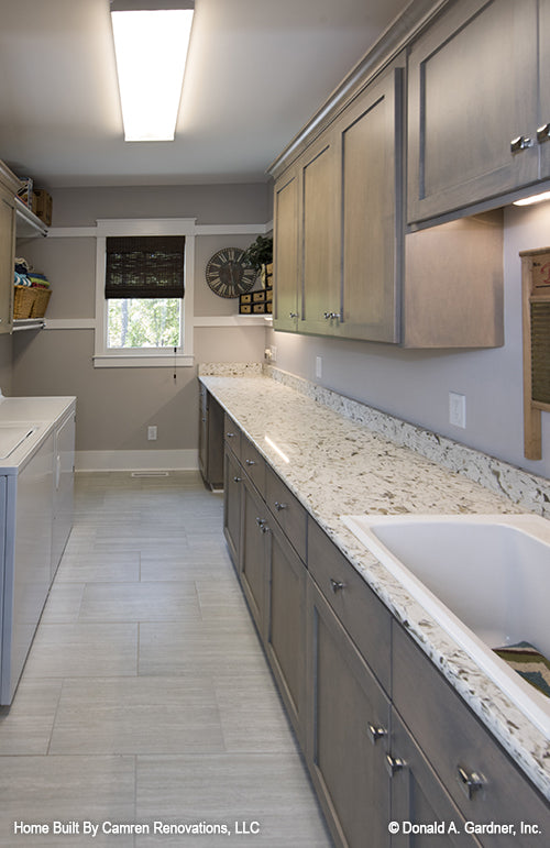 Utility room with large countertop and sink pictured for Markham house plan 1299