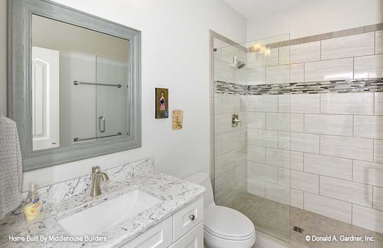 Single sink vanity and walk-in shower in the bathroom. The Mayfair plan 1317.