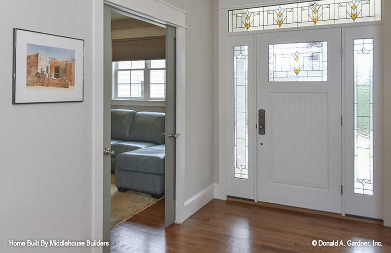 Frosted and stained glass along the entry door in the foyer. The Mayfair plan 1317.