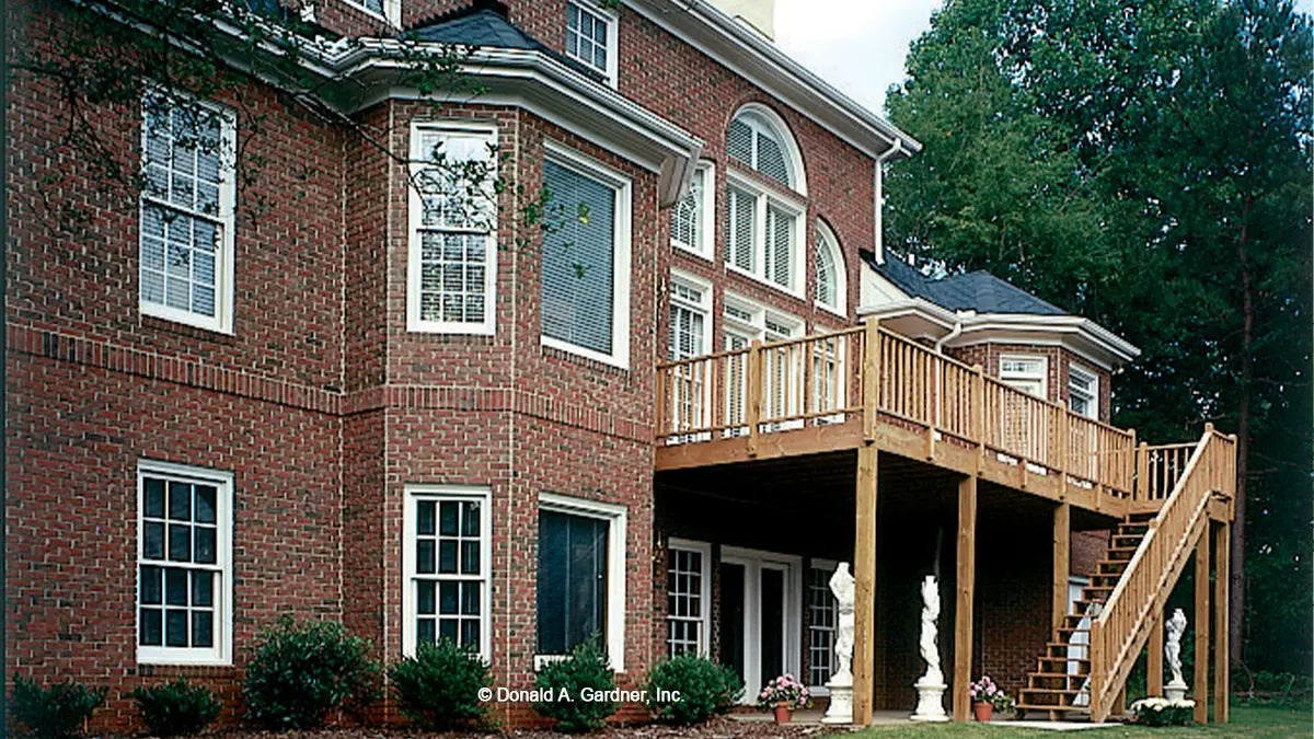 Rear view photograph showing walk-out basement. The Mercer plan 372.