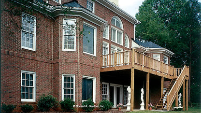 Rear view photograph showing walk-out basement. The Mercer plan 372.