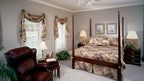 This is a photograph of the master bedroom of farmhouse plan 235 The Merrifield as built by a customer