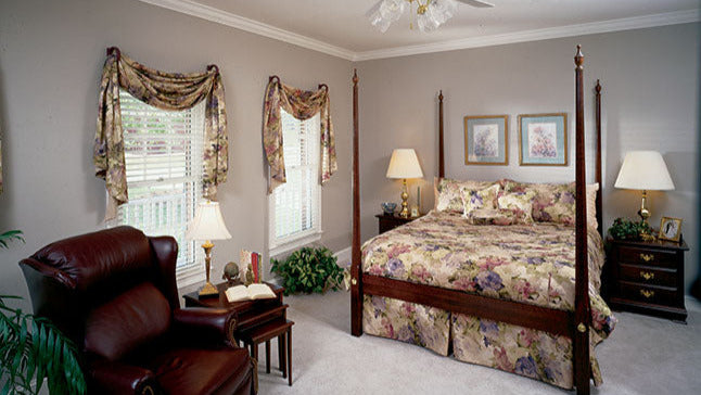 This is a photograph of the master bedroom of farmhouse plan 235 The Merrifield as built by a customer