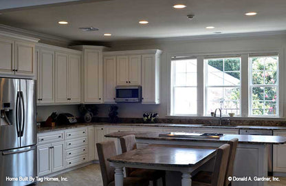 Triple windows behind the kitchen sink. The Merrill plan 1209