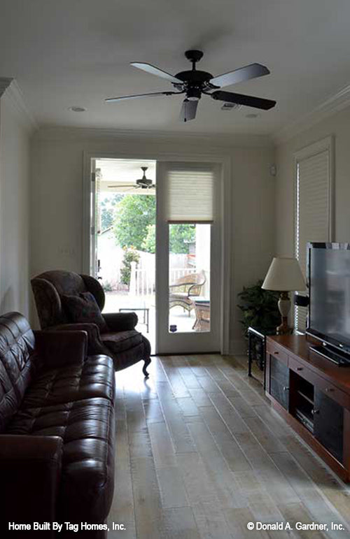 Sitting room with glass patio door for entry from the porch. The Merrill plan 1209