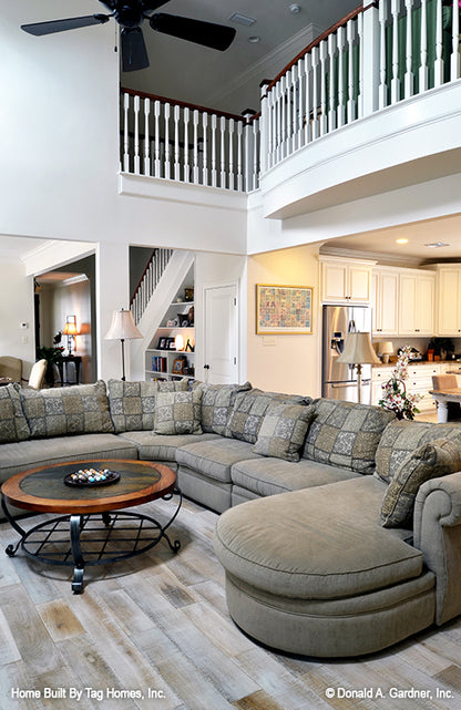 Great room sofa with loft banister above. The Merrill plan 1209