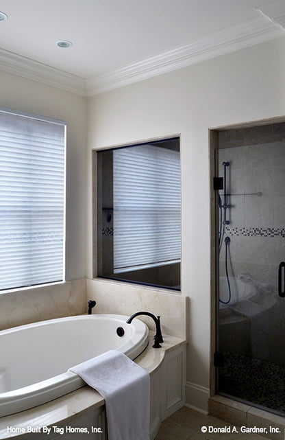 Soaking tub next to the walk-in shower in the master bathroom. The Merrill plan 1209