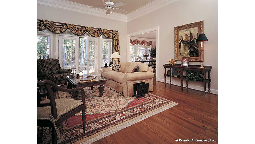 Wood floors and glass French patio doors in the great room. The Milford plan 331. 