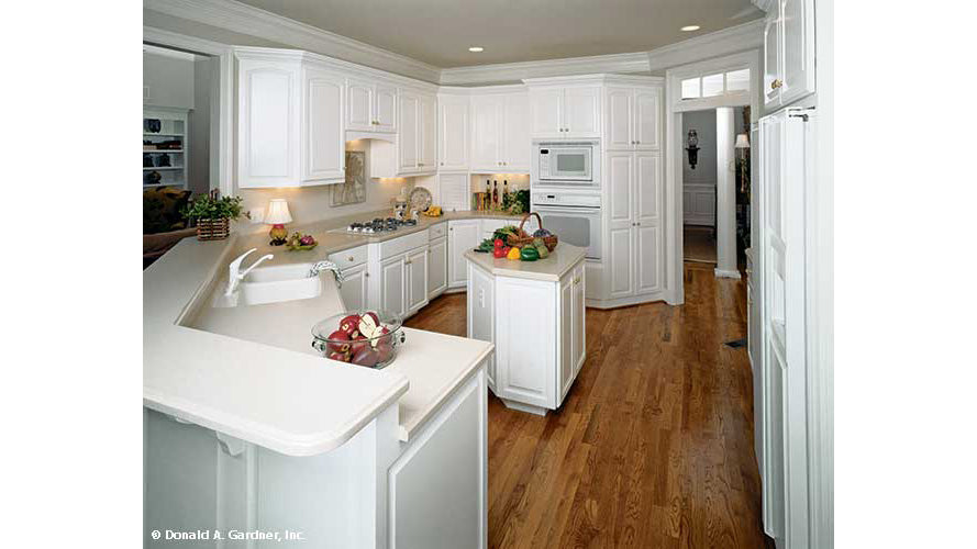 White cabinets in the kitchen. The Milford plan 331. 