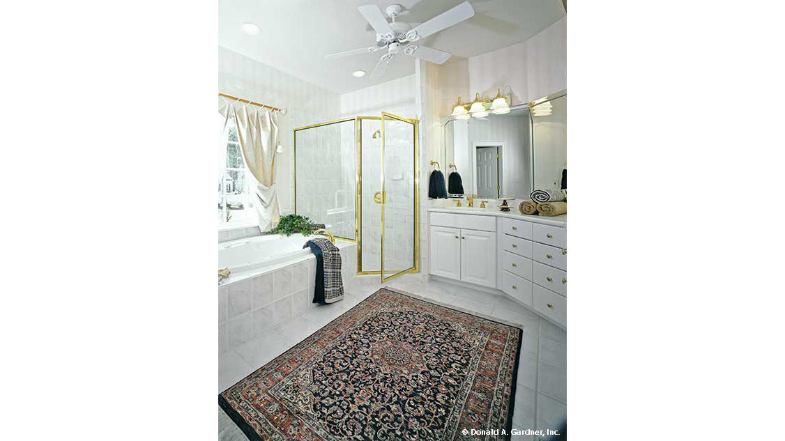 Soaking tub next to the walk-in shower in the master bathroom. The Milford plan 331. 