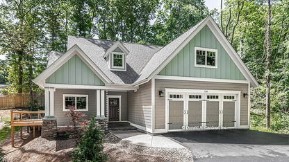 This is a photograph of another angle of the front of two story house plan 1559 The Millicent