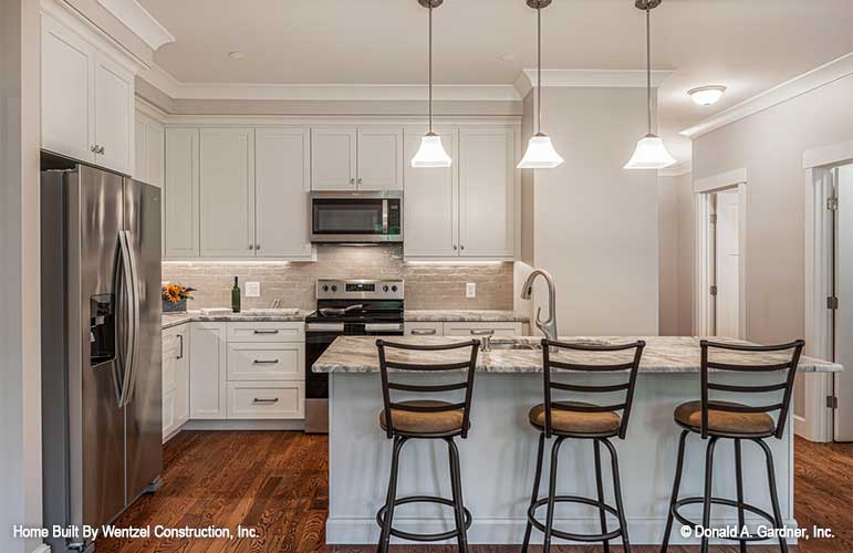 This is a picture of the kitchen with island for house plan 1559 The Millicent