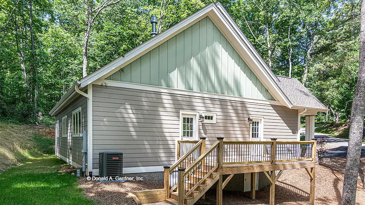 This is a photograph of the rear of narrow lot house plan 1559 The Millicent as built by a customer