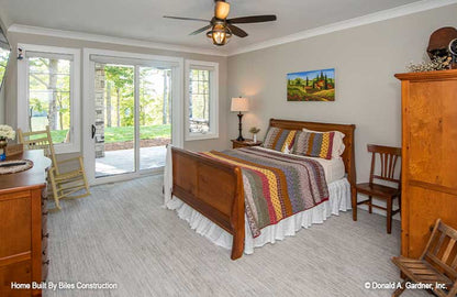 Bedroom with outside access with sliding glass door.